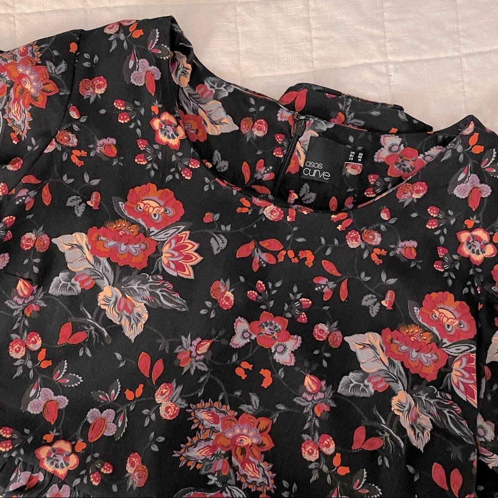 Black swing dress with red floral print